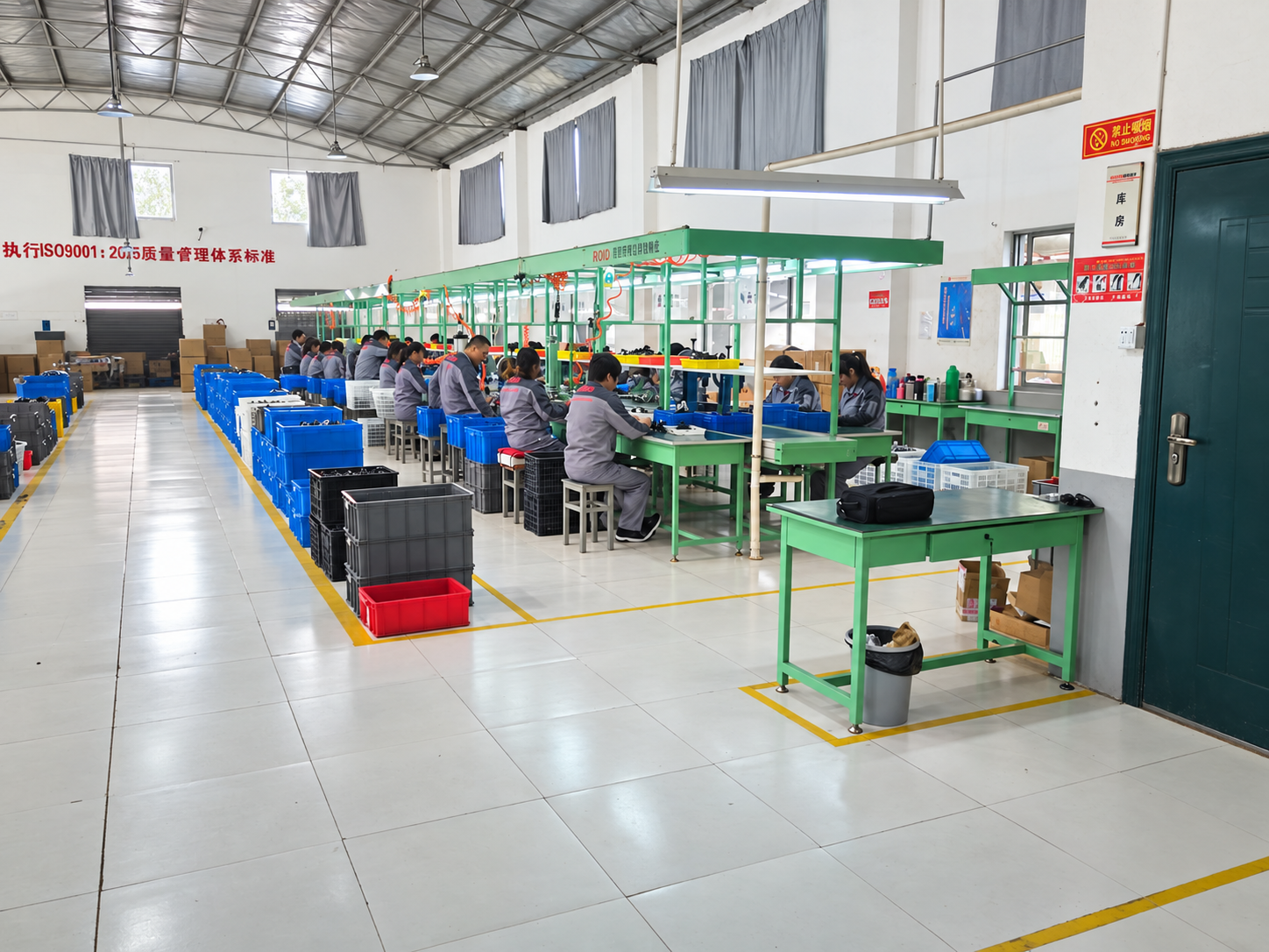 Employees assembling products on a production line marked ROJO